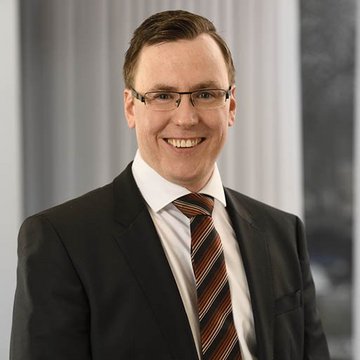 Leiter der Betriebsverpflegung Christian Löffler von apetito catering lächelnd im Portrait